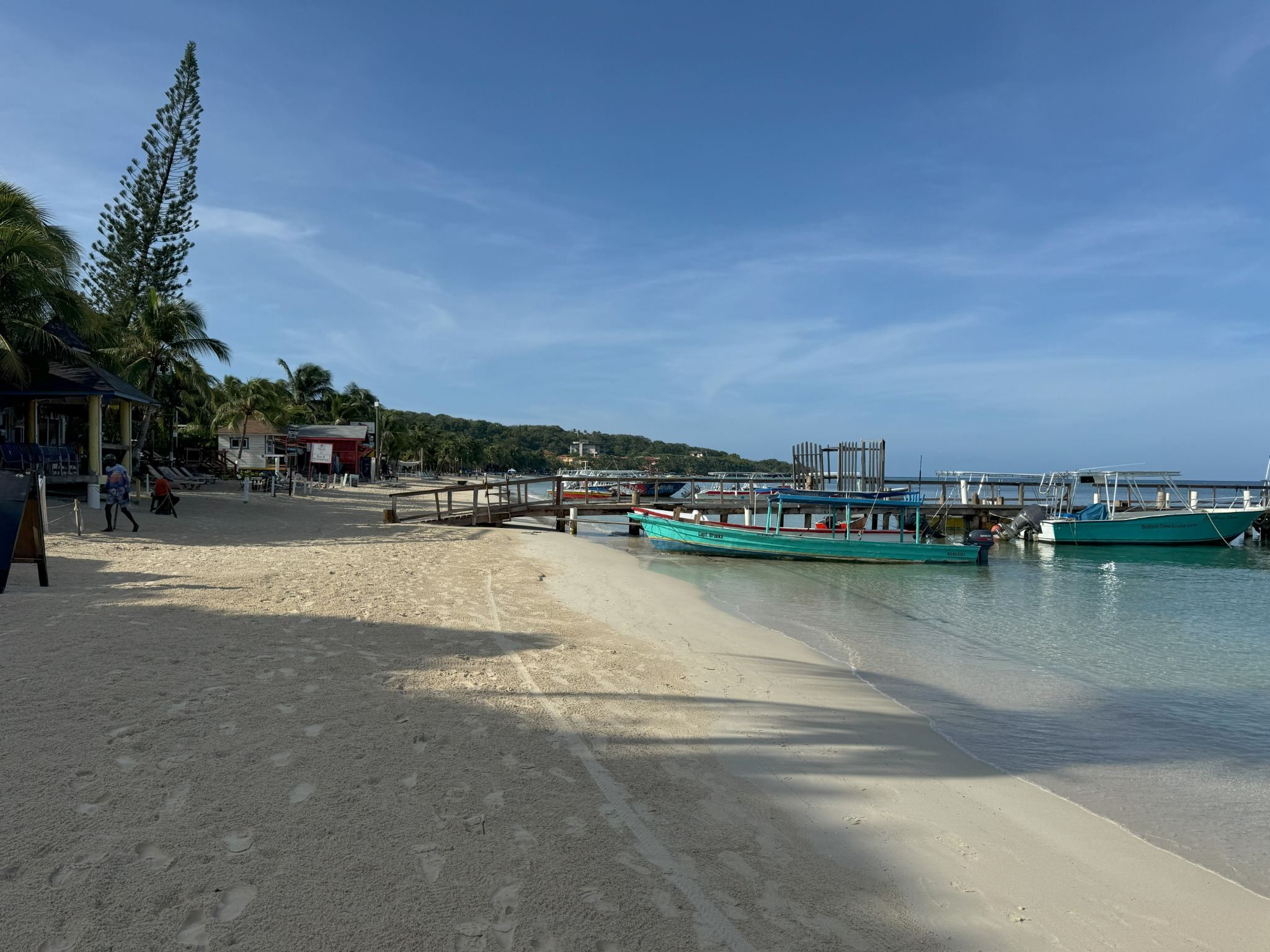 Boats and village rhythm along West Bay